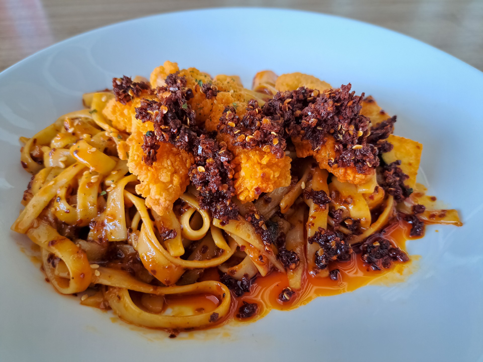 Delicious Flaming Hot Chicken With Chicken Meat, Chicken Sausage, Fettuccine Pasta, Scallions, and Chili Oil. Food Menu.