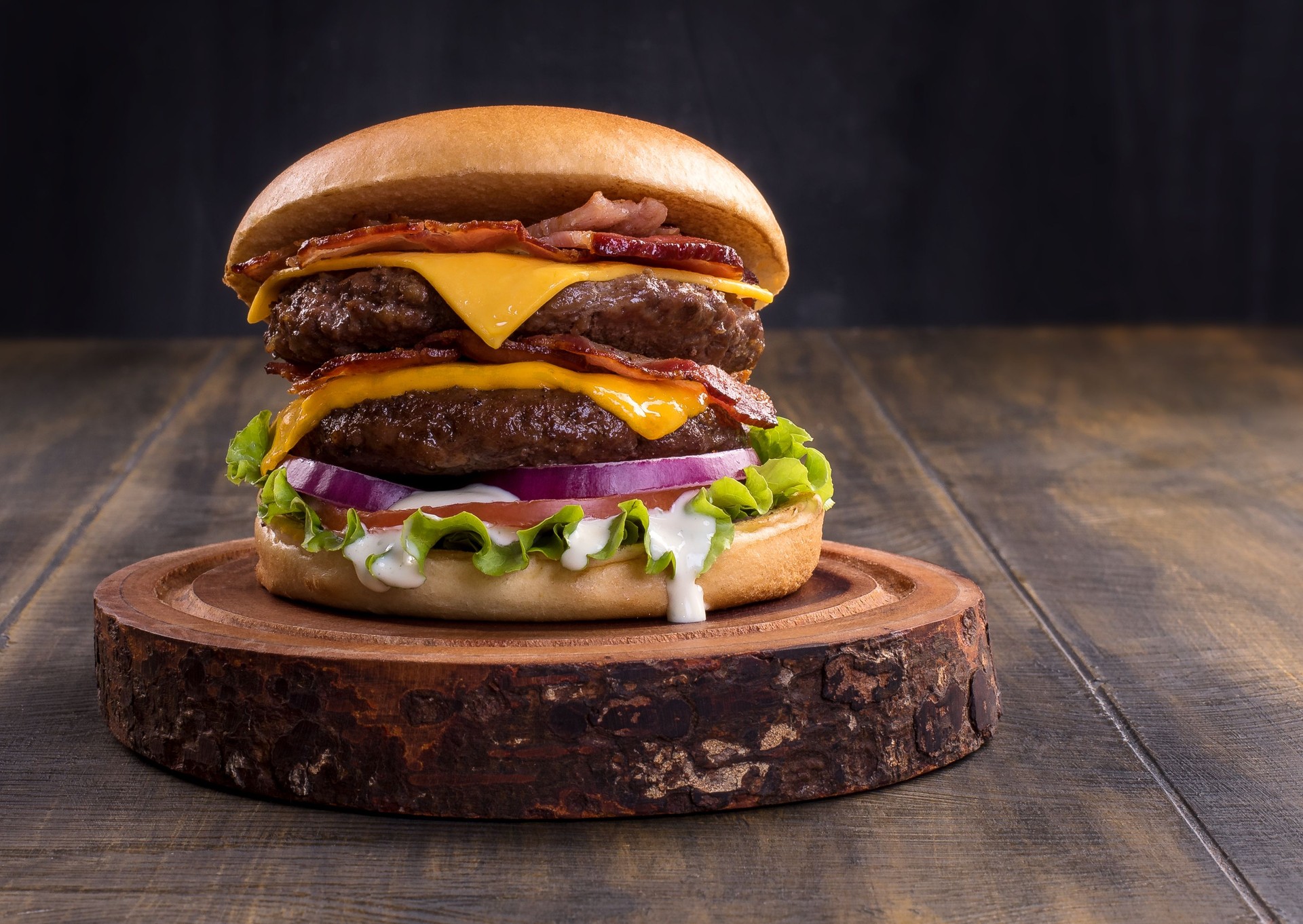 Fresh tasty burger on wood table.